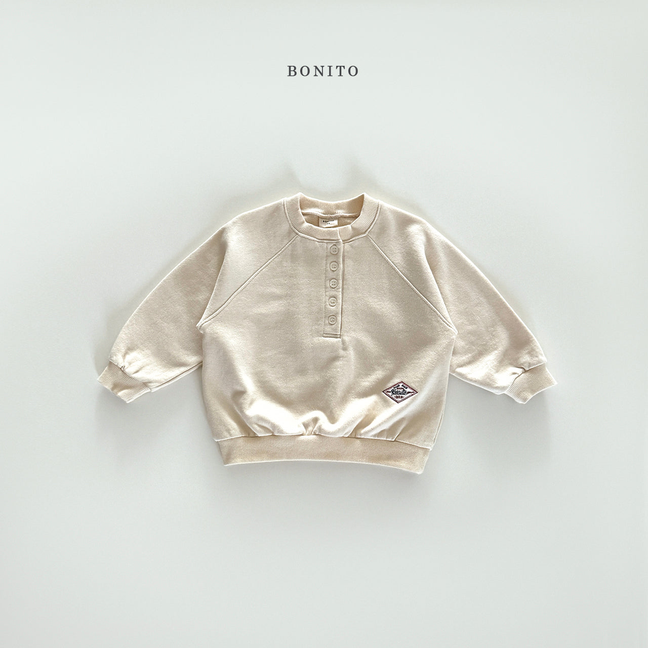 Henley Raglan Sweatshirt