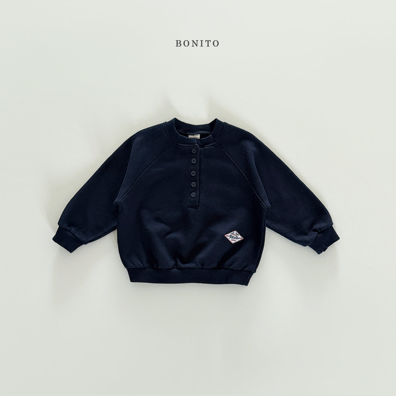 Henley Raglan Sweatshirt